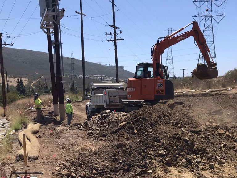 Hitachi excavator and Patriot General crews on transmission civil work