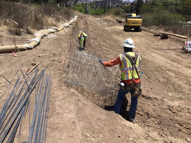 Patriot General crews placing rebar cages on transmission civil work
