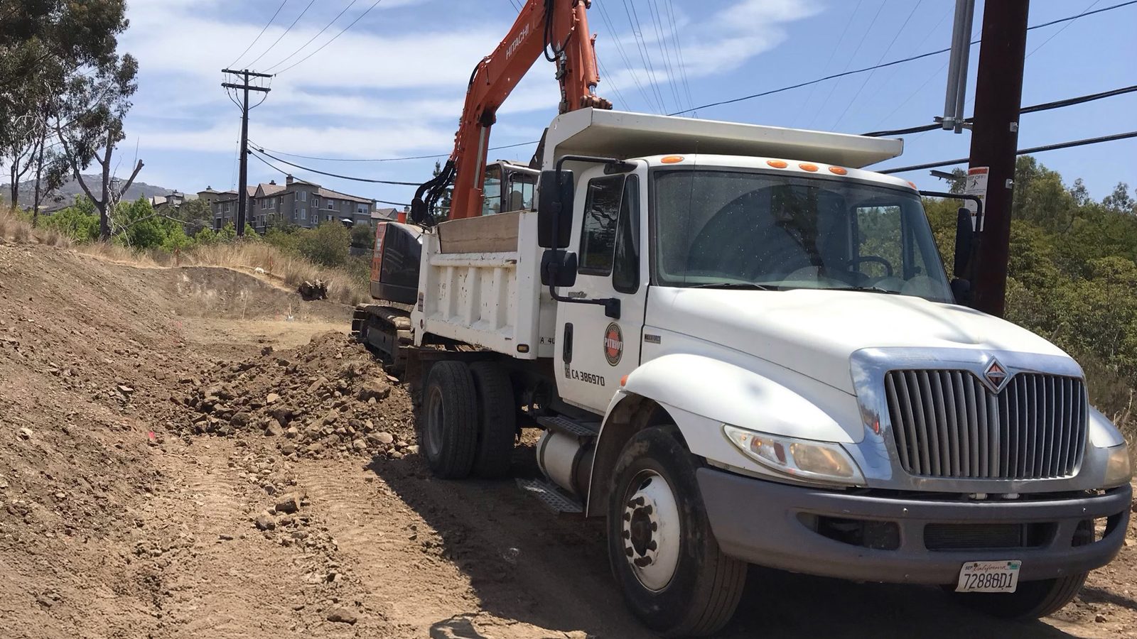 Dump trucks and civil construction on TL6975